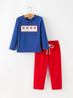 Two-piece boys Christmas set with royal blue long-sleeve shirt with embroidered Santa panel and red pants