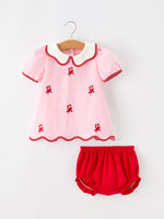 Pink short-sleeve top with candy cane embroidery and white Peter Pan collar, paired with red bloomers with ruffle leg