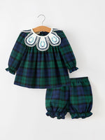 Girls green and navy plaid two-piece set with long-sleeve top, white embroidered collar, lace trim, and ruffled bloomers