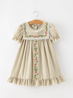 Girls khaki plaid dress with floral embroidered bib front, white lace trim, puff sleeves and ruffled hem