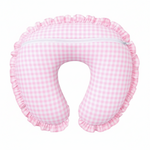 Soft pink gingham ruffle nursing pillow cover by Little Mae & Co, styled in a cozy baby nursery.