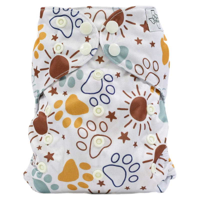 Slim fit pocket cloth diaper with colorful animal prints and multiple snaps for adjustable fit.