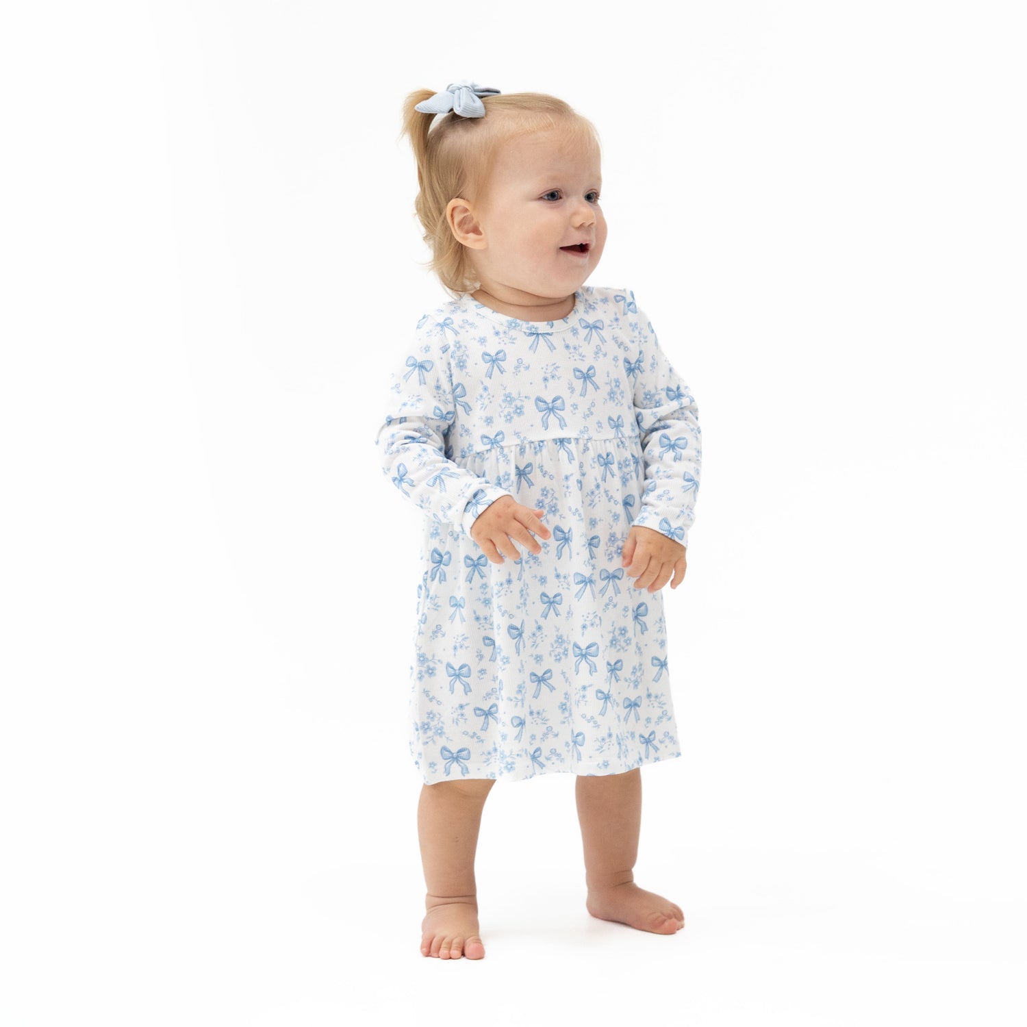 Baby dress and matching bloomer set in a blue bows and flowers print with a flowy skirt.