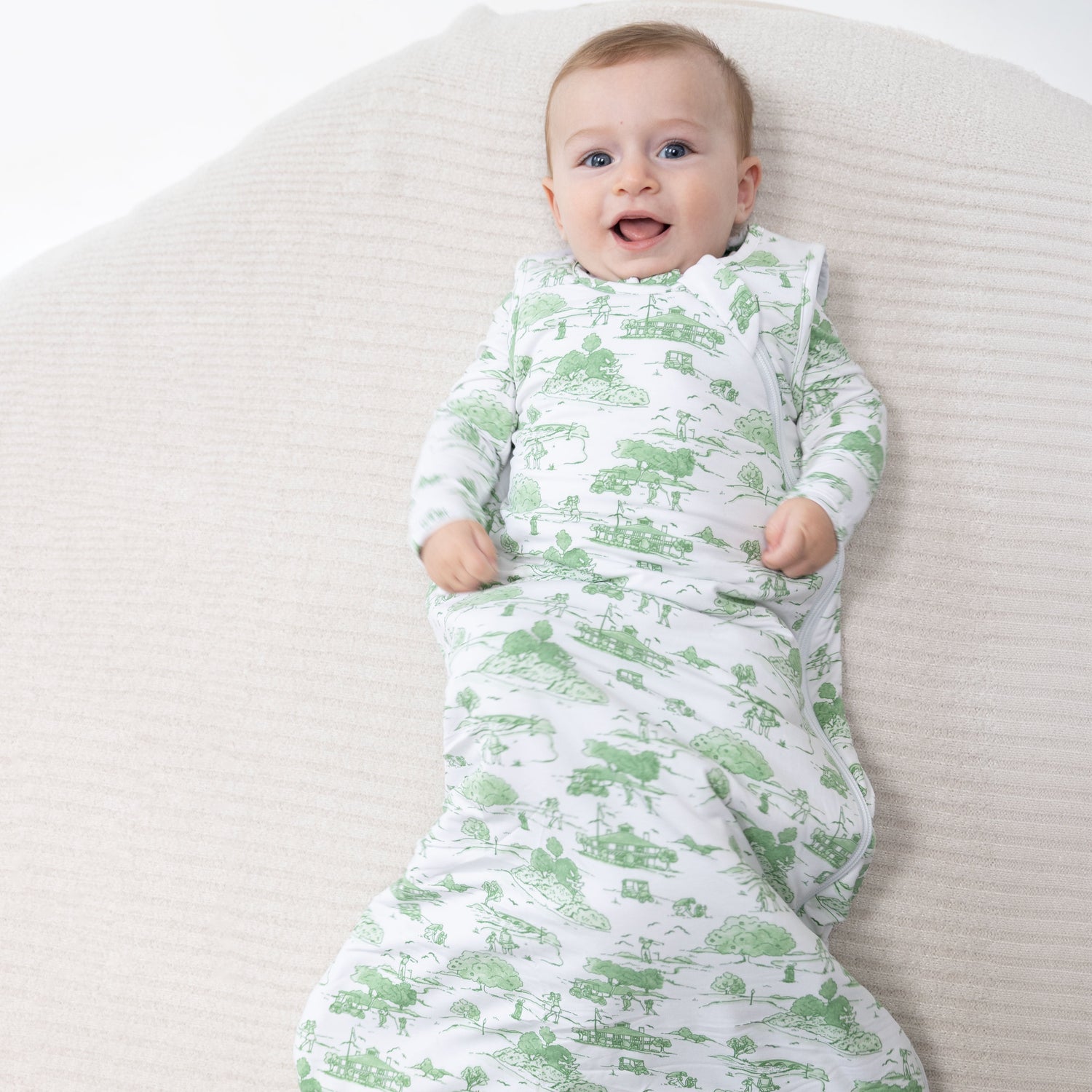 Sleep sack in green golf toile print with a full-length front zipper and sleeveless armholes.