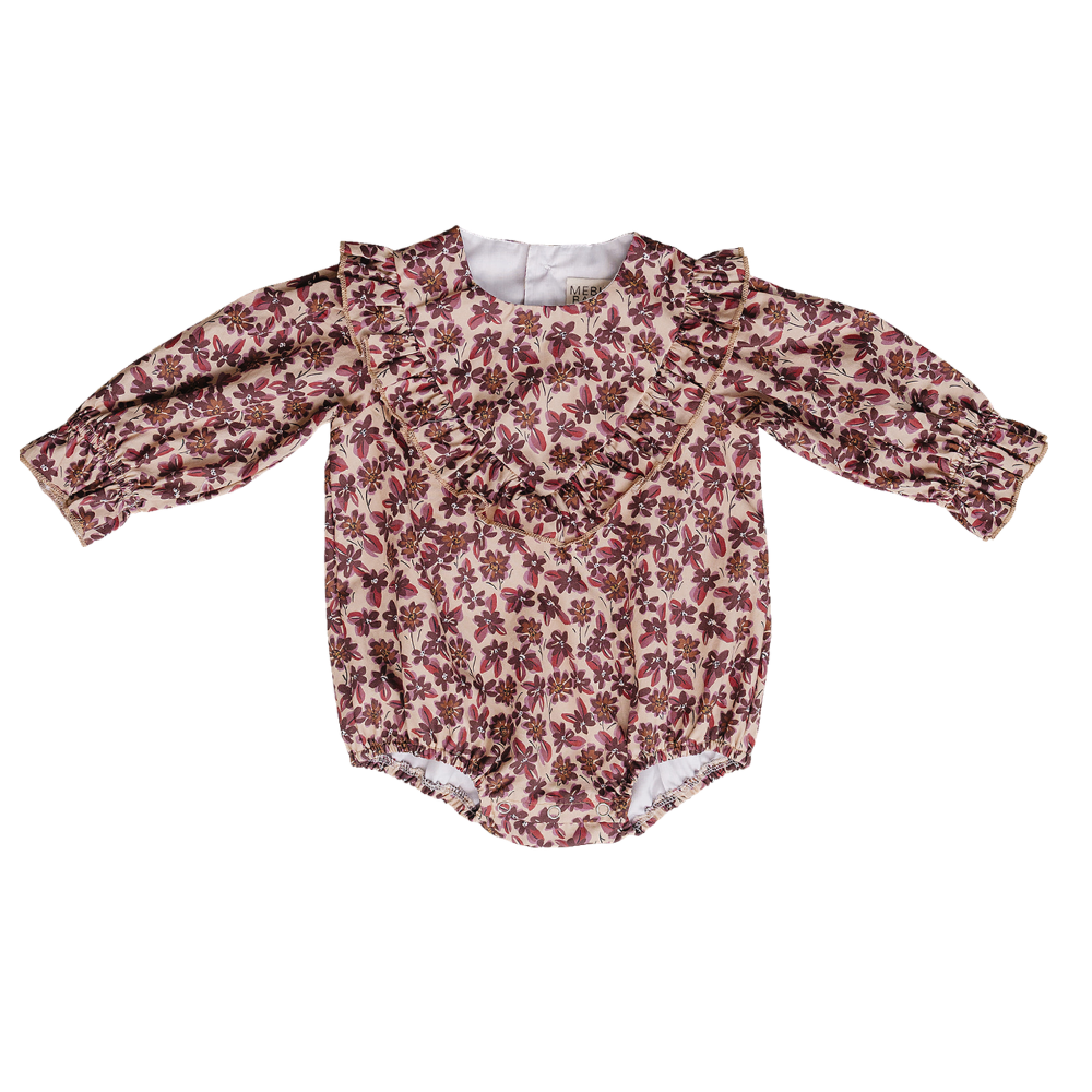 Long-sleeve bubble romper in antique floral print with ruffle collar details and snaps at the bottom