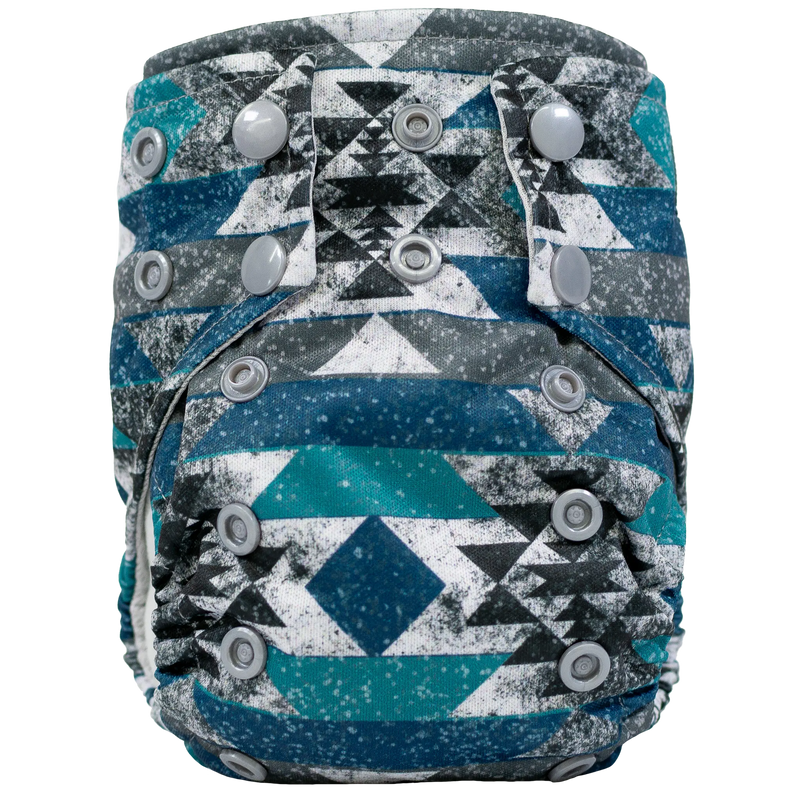 Tiny Tushies Newborn AIO cloth diaper with geometric pattern and secure snaps.