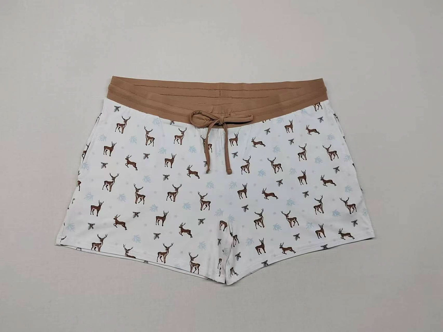 Adult lounge biker shorts in a reindeer print with a short inseam