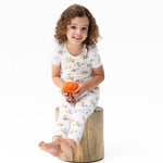 Two-piece short sleeve baby loungewear set with woodland animals and pumpkins print, top and pull-on pants