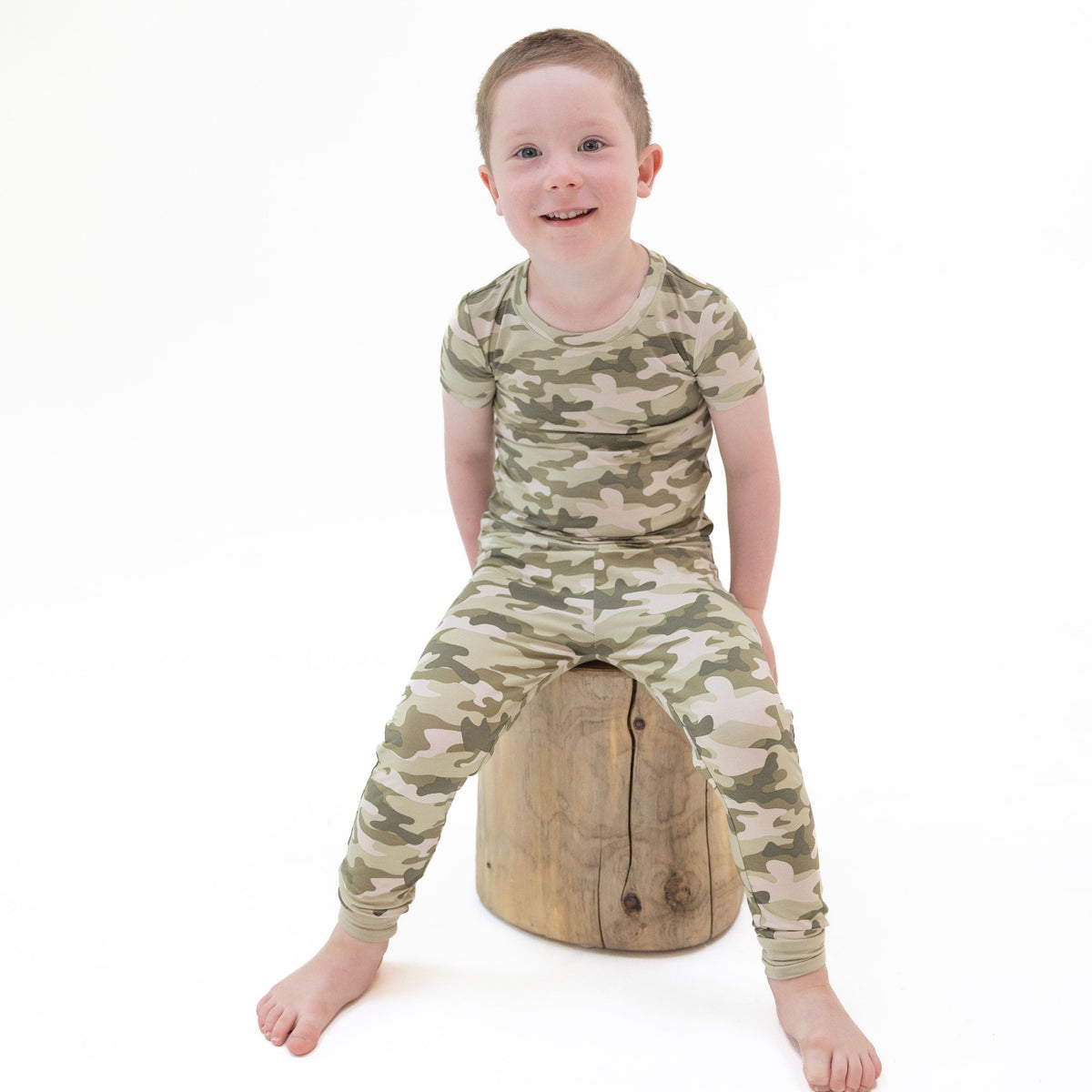 Two-piece short sleeve loungewear set with camo print top and matching pull-on pants
