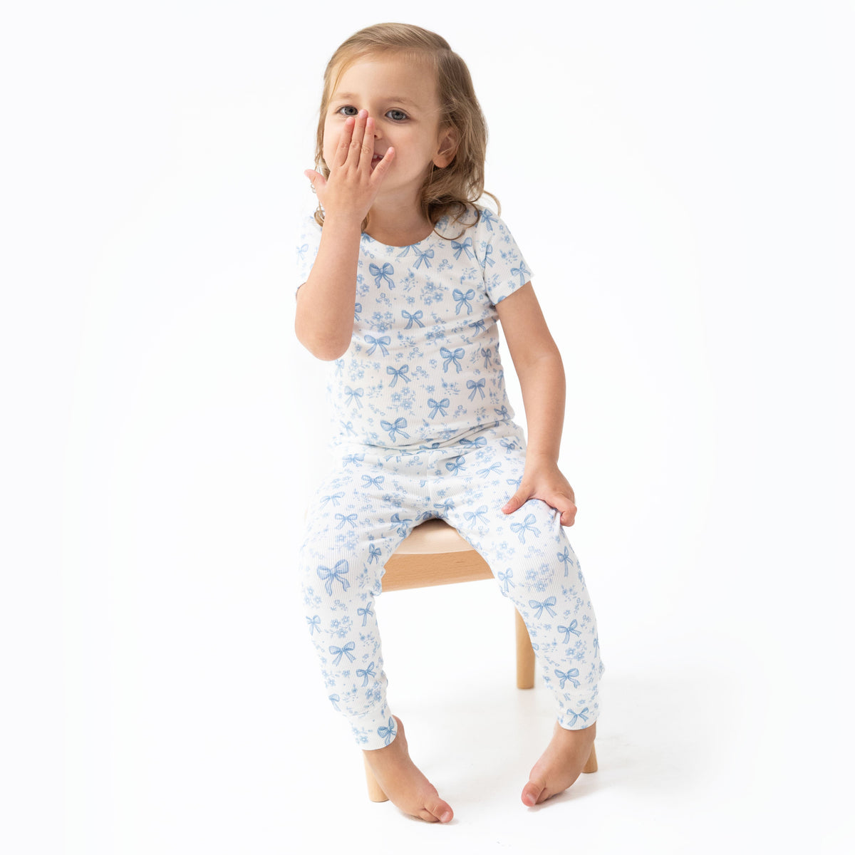 Short sleeve loungewear set with a blue bows and flowers print, ribbed short-sleeve top and matching pull-on pants.