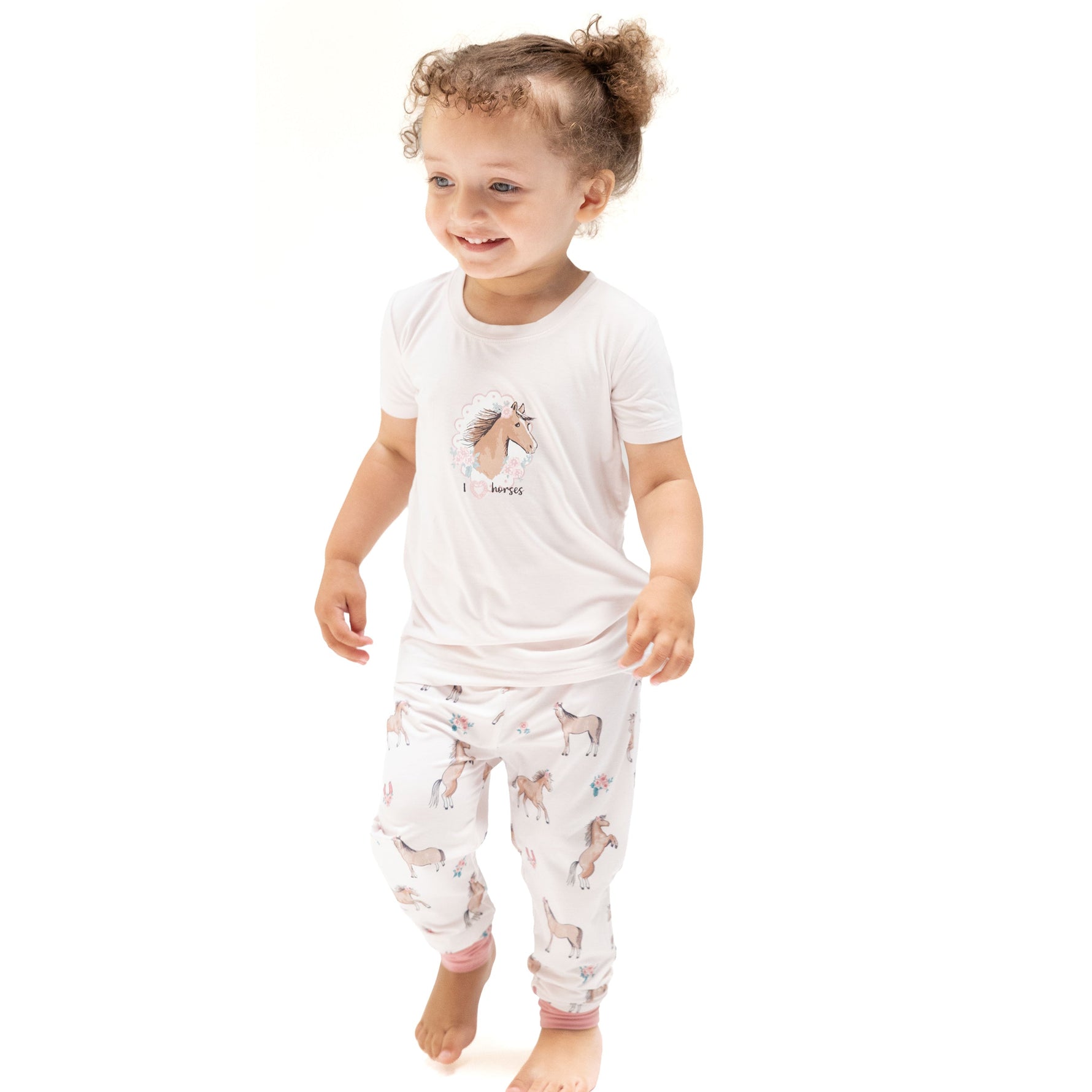 Two-piece short sleeve baby pajama set with horse print top and matching pull-on pants