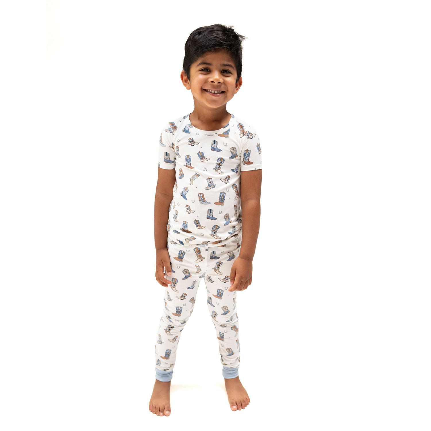 Two-piece loungewear set with short-sleeve top and pull-on pants in a Western-inspired boot print