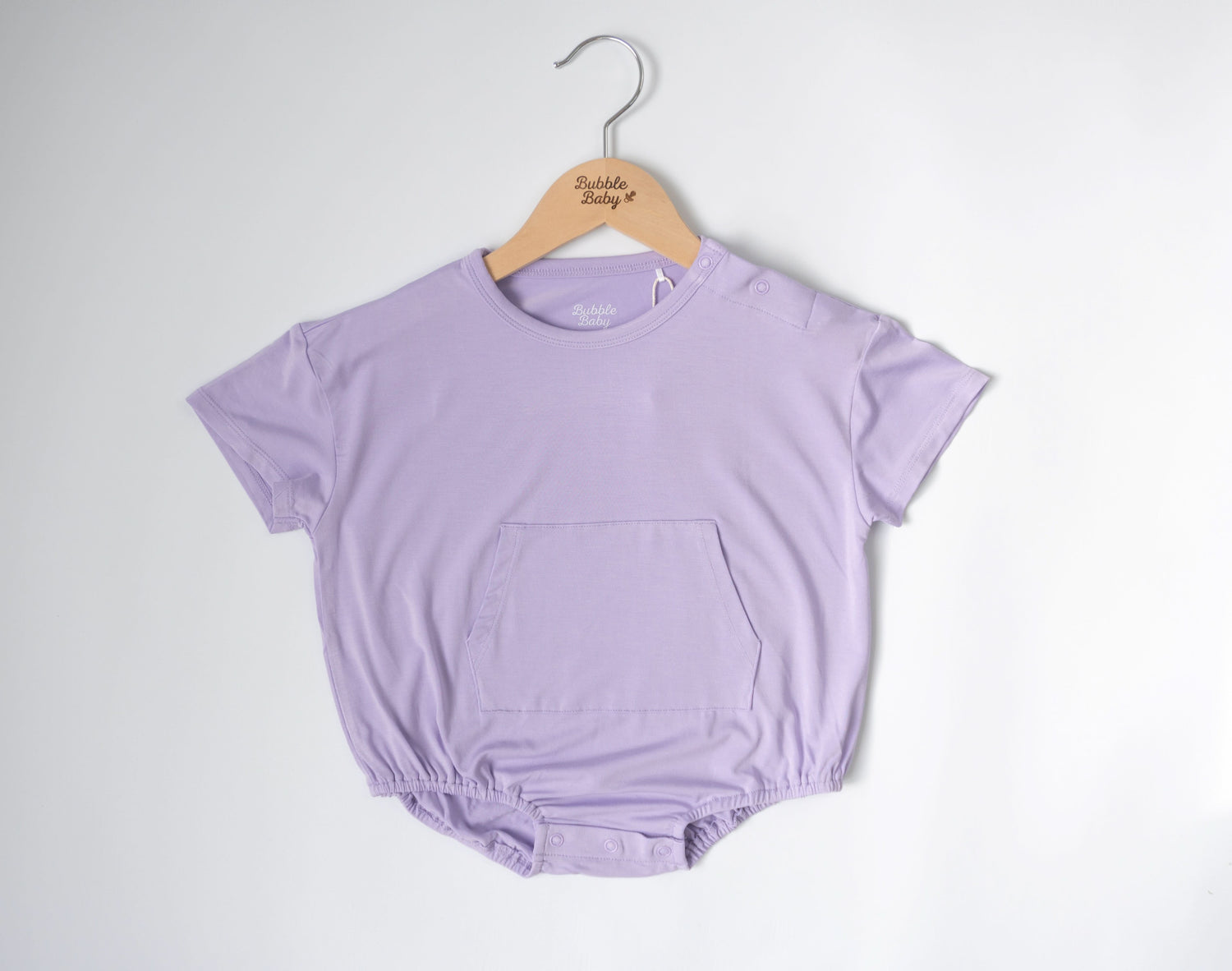 Lilac short sleeve bubble romper with snap closures at the neck and legs