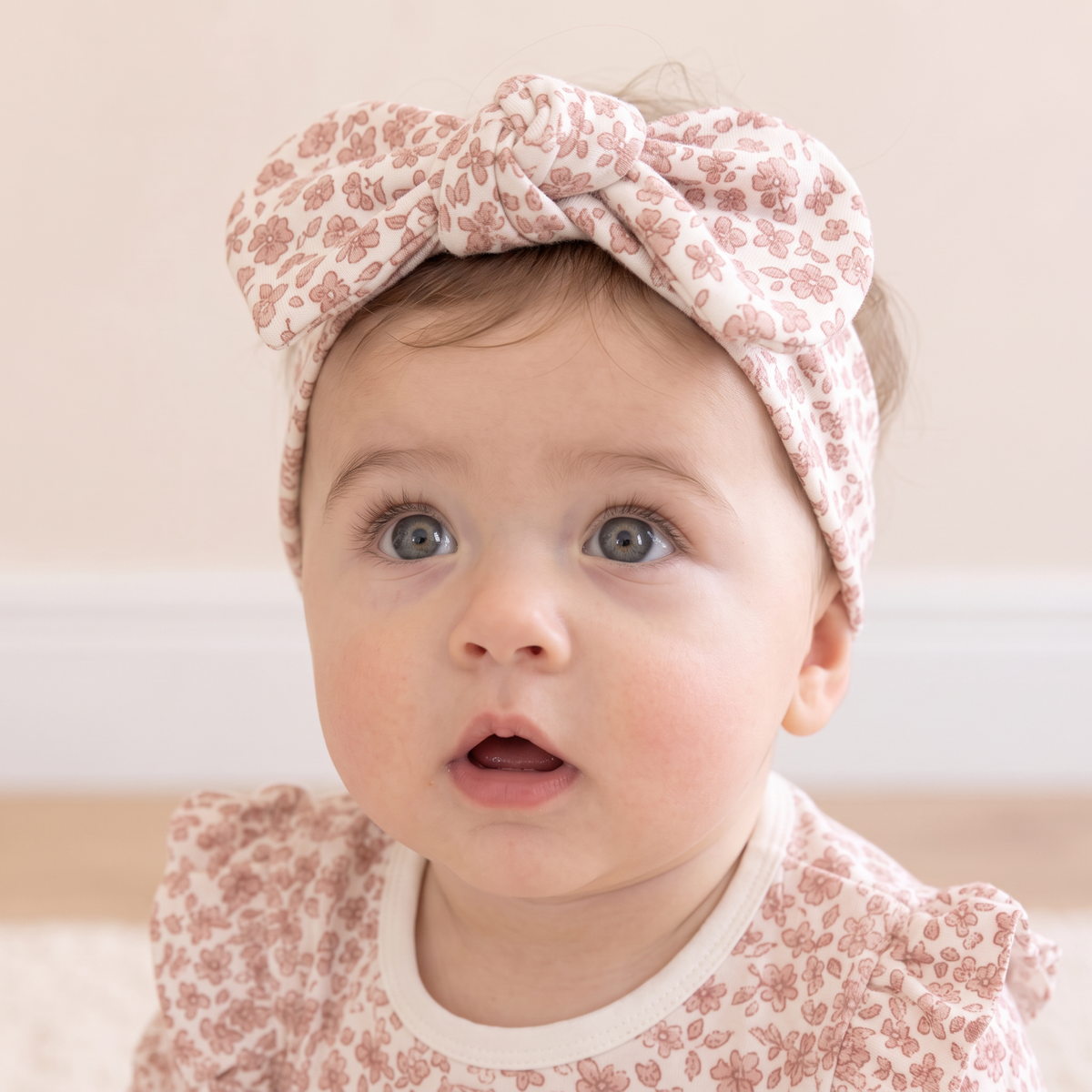 Baby headwrap in Wild Petal floral print with a knotted bow detail
