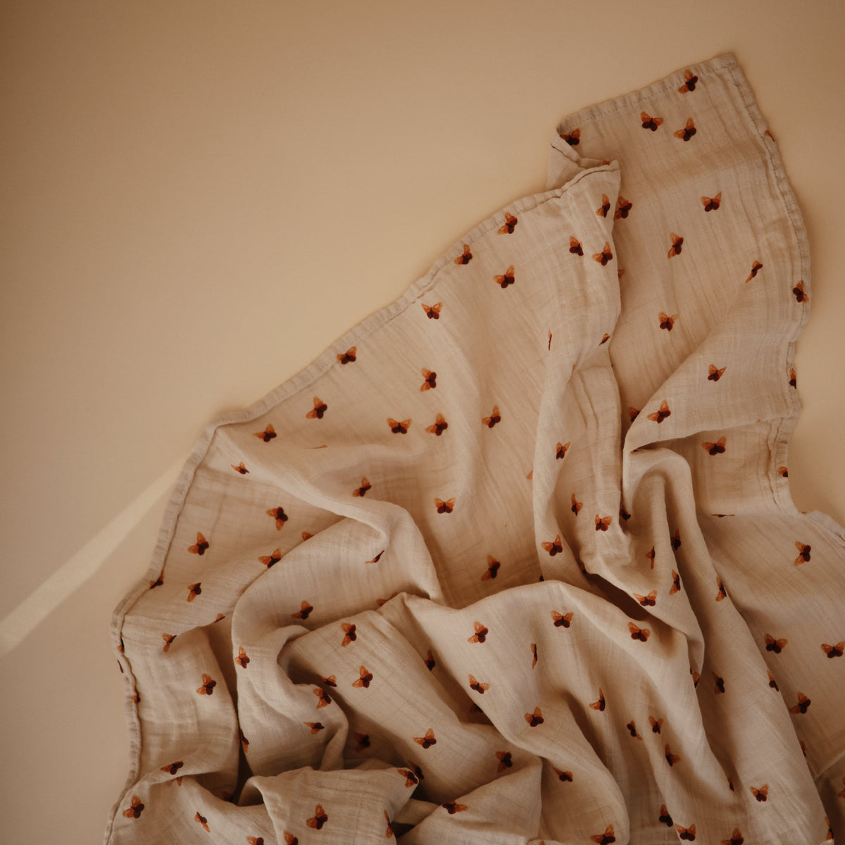 Mushie organic cotton muslin swaddle blanket, soft, breathable baby essential.