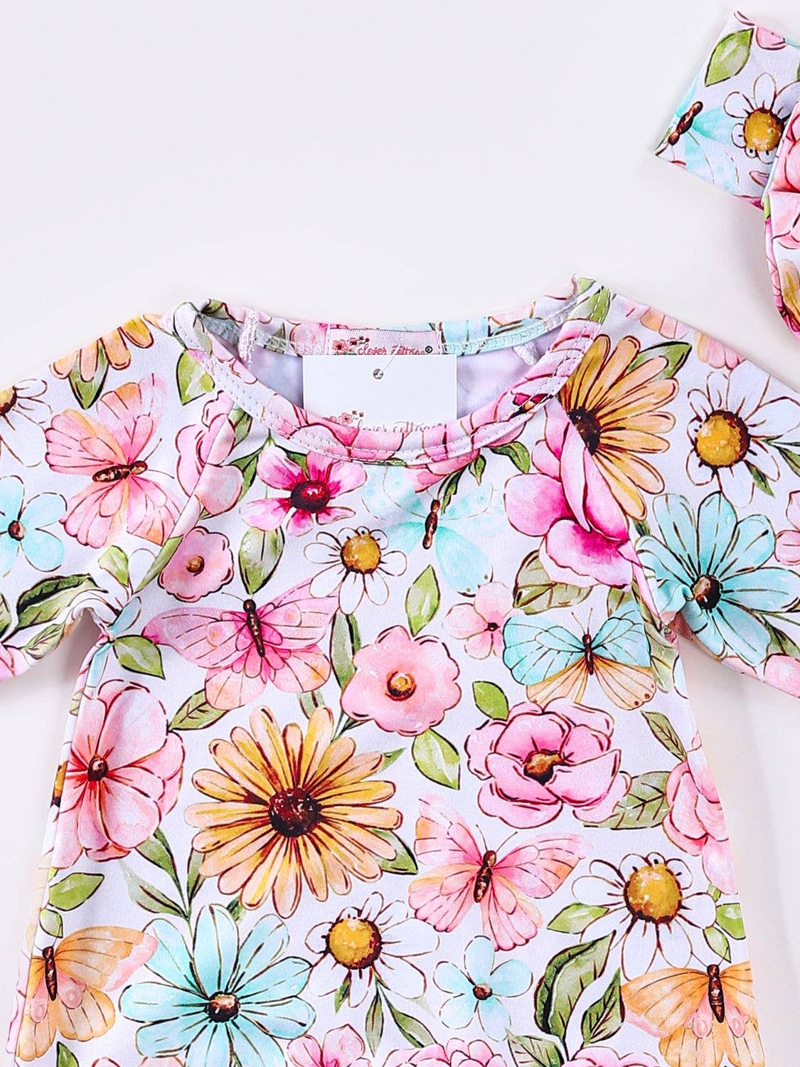 Clover Cottage butterfly floral baby gown with matching headband for newborns.