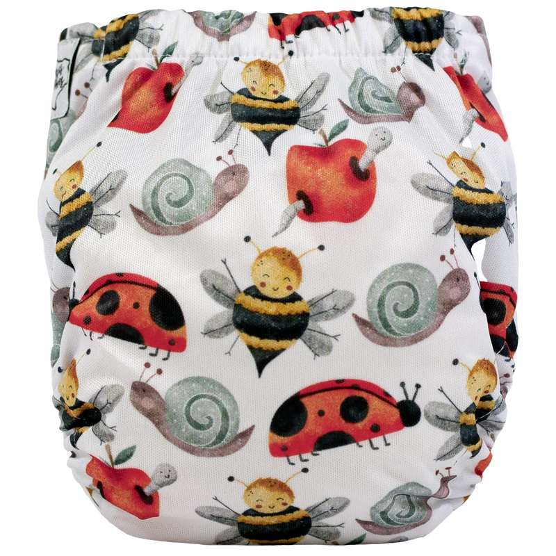 Tiny Tushies Newborn AIO Cloth Diaper with nature-inspired print, fits 5-20 lbs, featuring pocket opening.