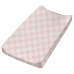 Pink Sugar Checkered Changing Pad Cover from Little Mae & Co, featuring a soft pink and white grid pattern.