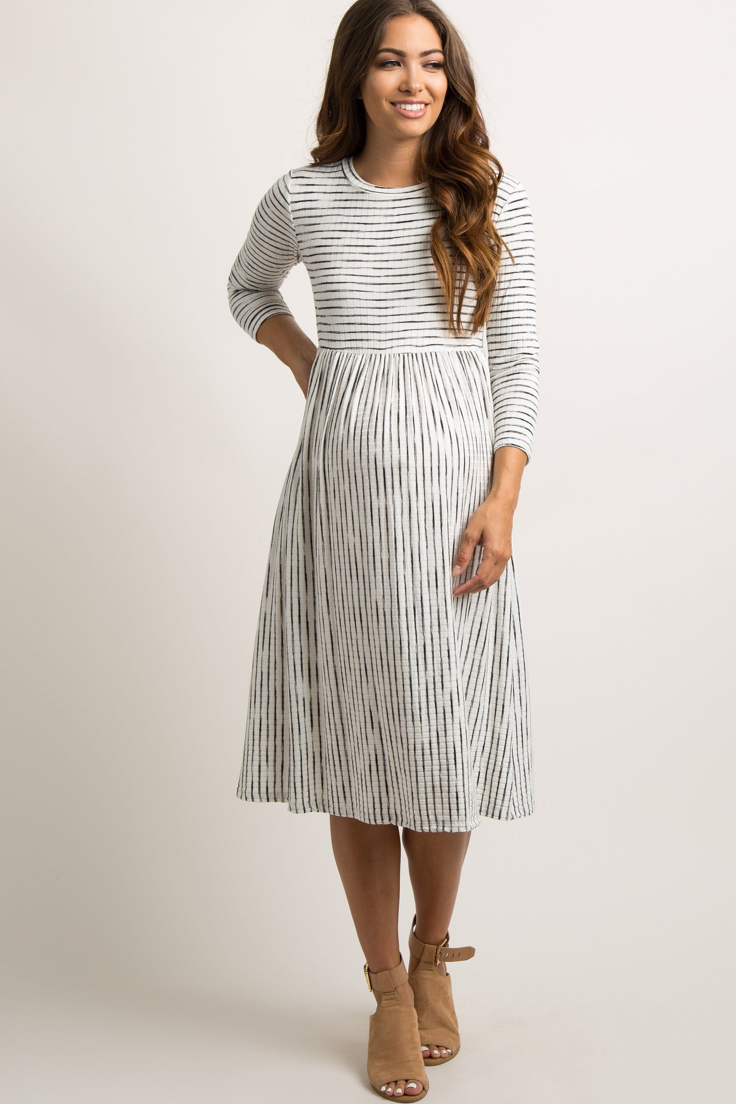 Ivory ribbed maternity midi dress with subtle stripes, short sleeves, and a fitted silhouette