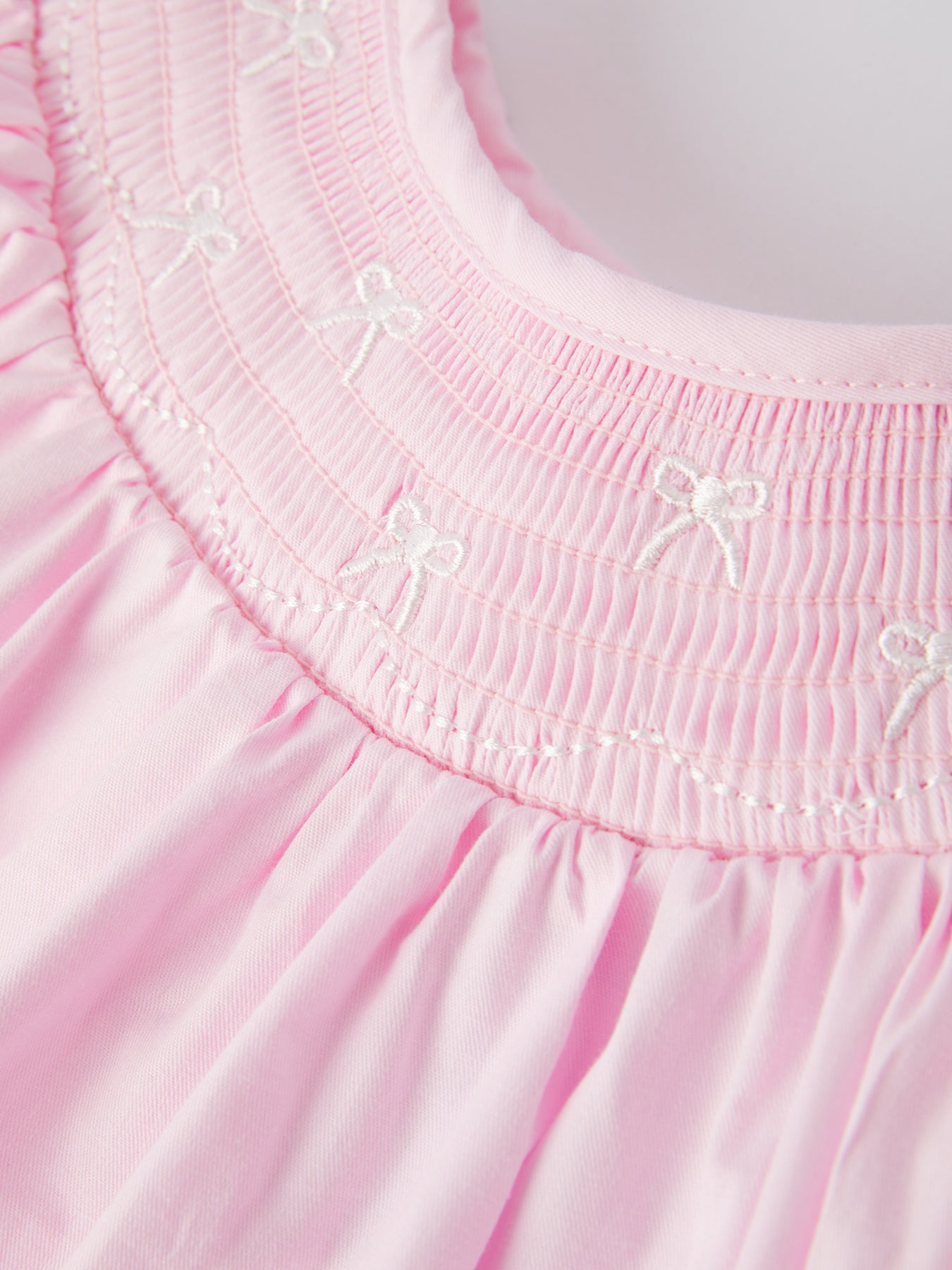 White Bow Smock Embroidered Pink Dress by Rylee Faith Designs at Everetts Place