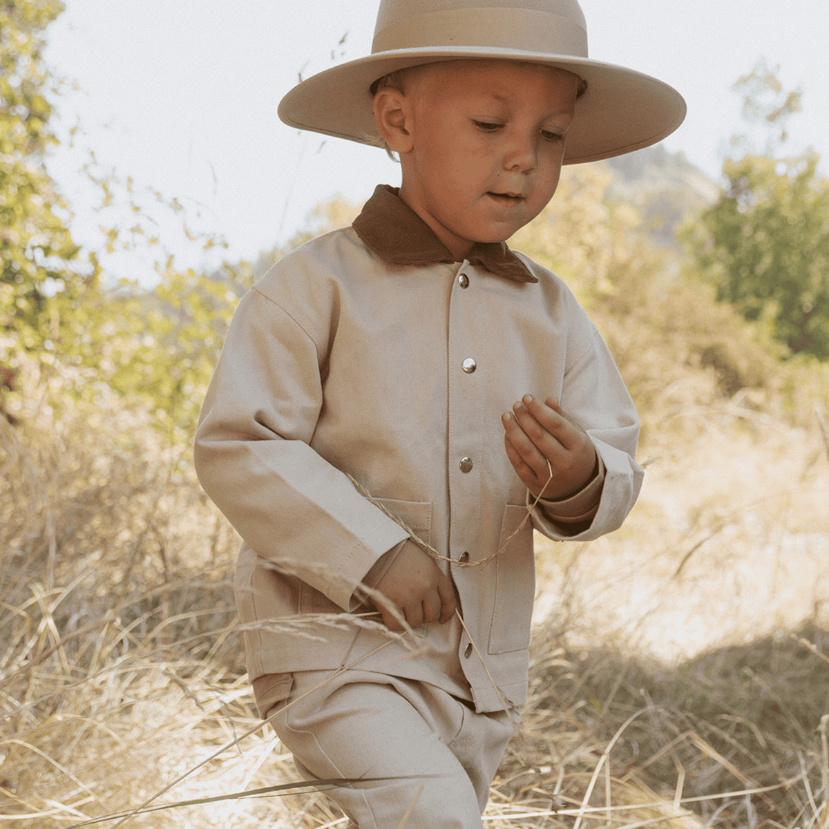 Oat-colored twill button-front jacket with a classic collar and front pockets