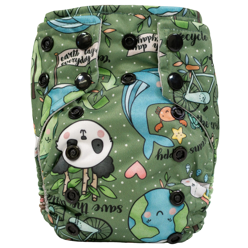 Tiny Tushies Newborn AIO cloth diaper with nature-themed print and adjustable snaps.