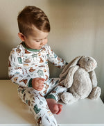 Two-piece baby pajama set in a Cottontail Garden bunny and floral print, long-sleeve top with matching pants.