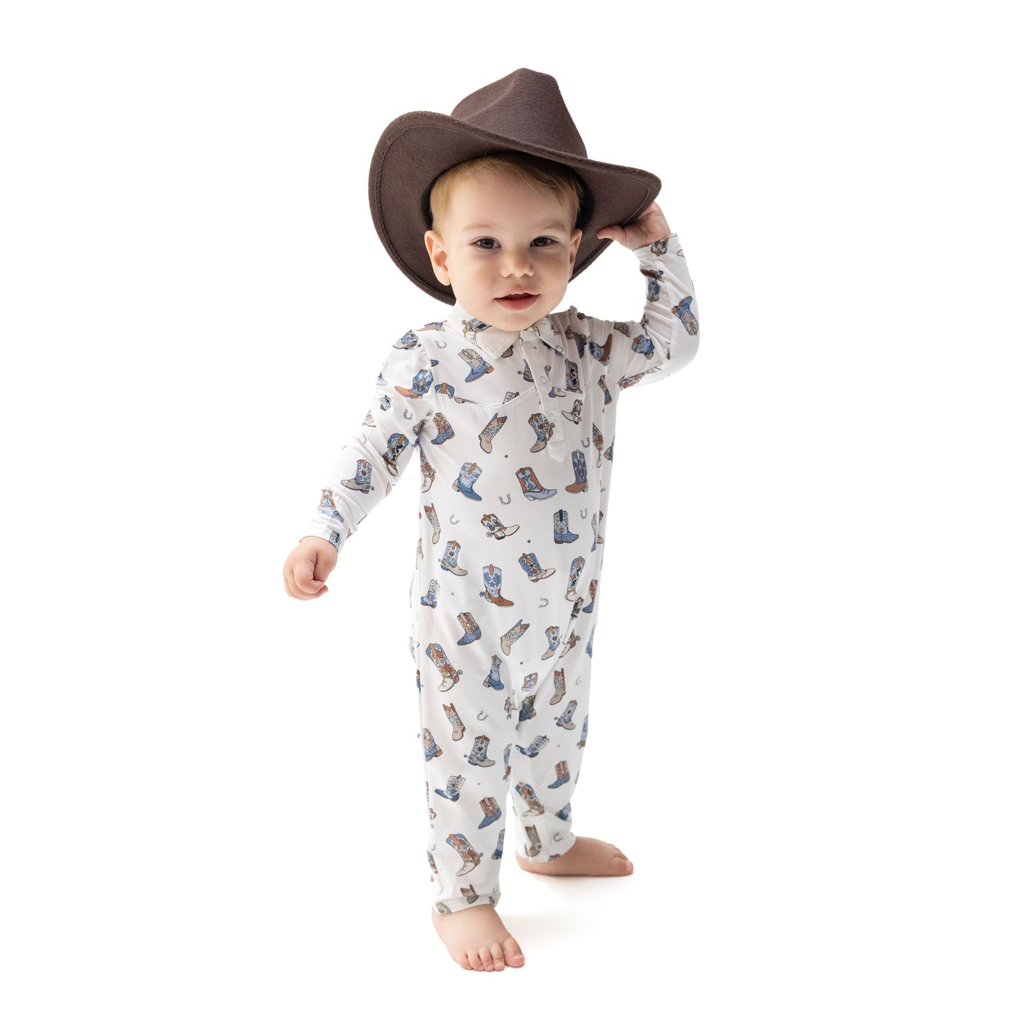 Long sleeve baby romper in viscose from bamboo with cowboy boot print and snap closures