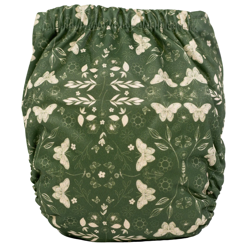 Tiny Tushies Newborn AIO Cloth Diaper with butterfly pattern on green fabric.