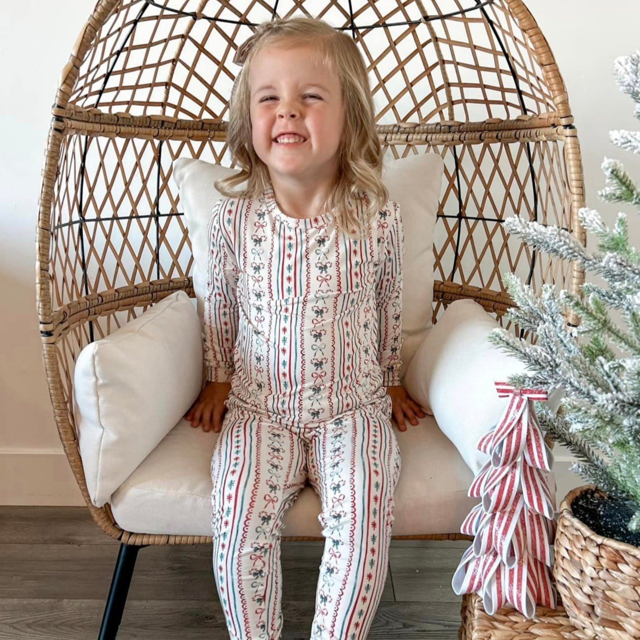 Two-piece candy cane striped Christmas pajamas with long-sleeve top and matching pants