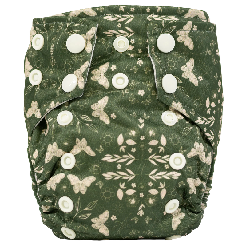 Tiny Tushies Newborn AIO Cloth Diaper with butterfly design and adjustable snaps.