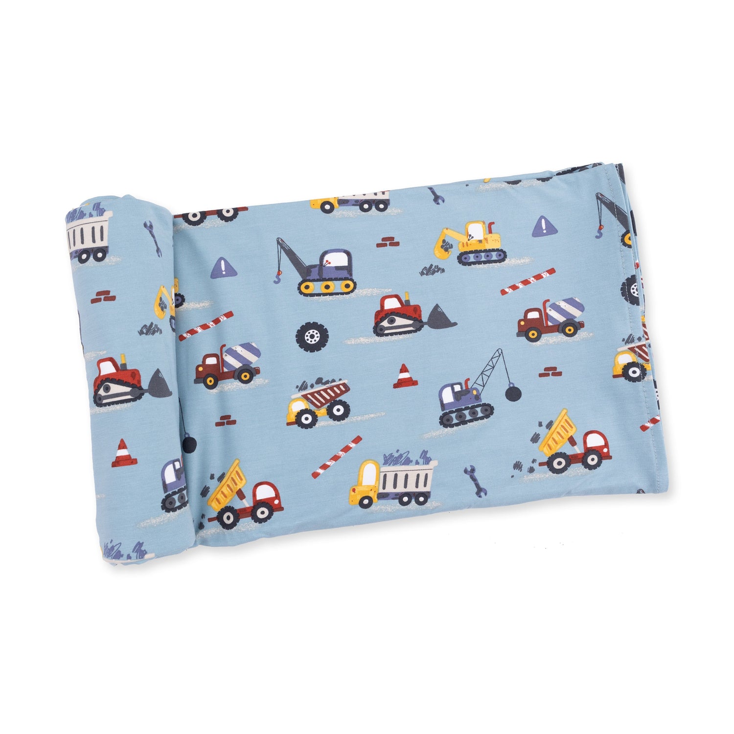 Swaddle blanket in a crayon-drawn construction print with trucks, diggers, and building vehicles
