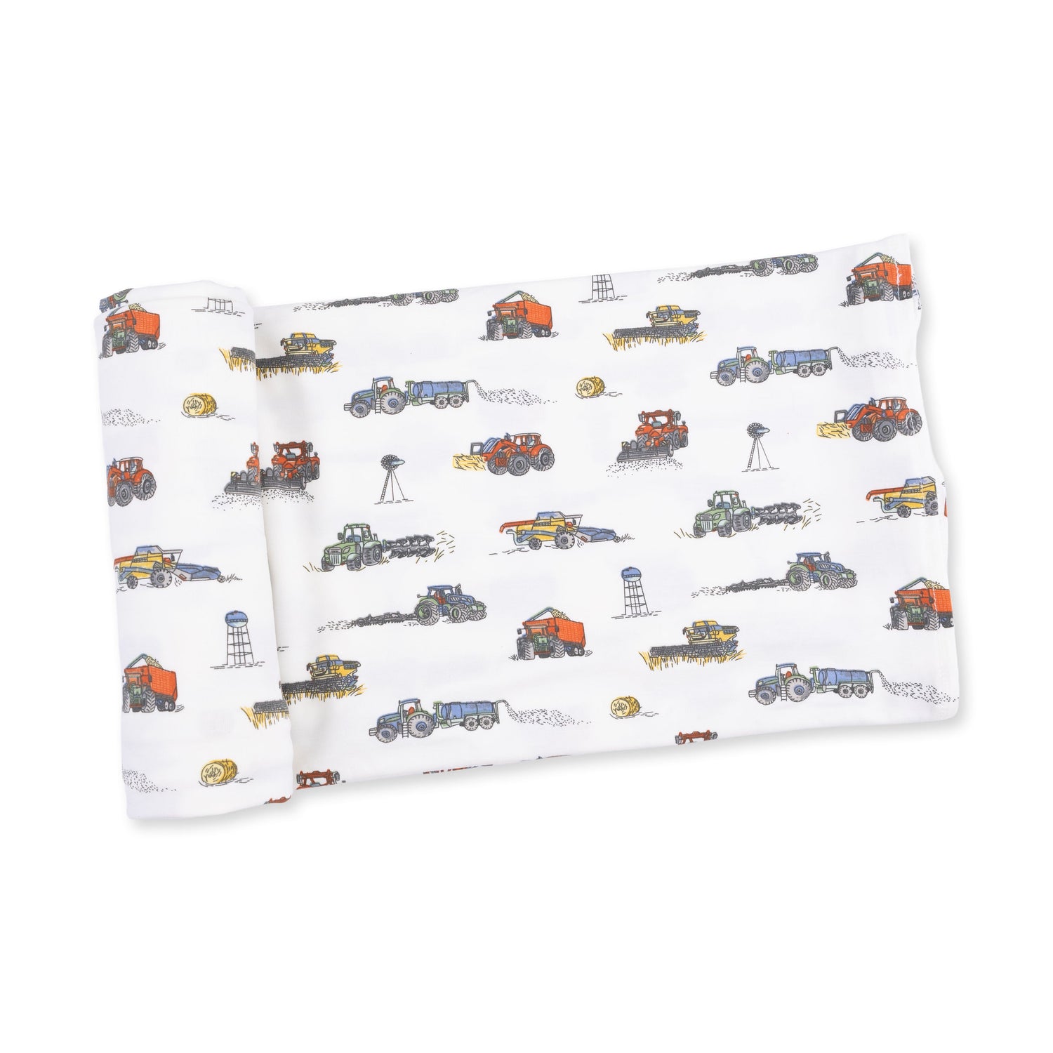Swaddle blanket with a farm machines print, including tractors, on a light background