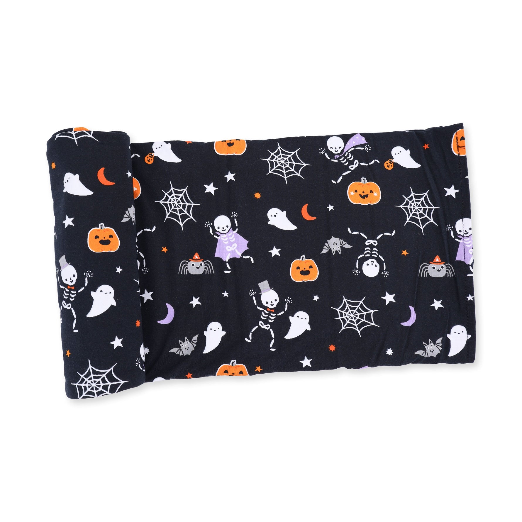 Swaddle blanket with a Halloween skeleton buddies print on a light background
