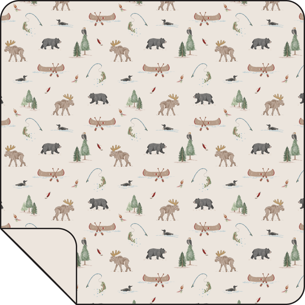 Swaddle blanket printed with northern woodland animals like bears, moose, and deer on a light background