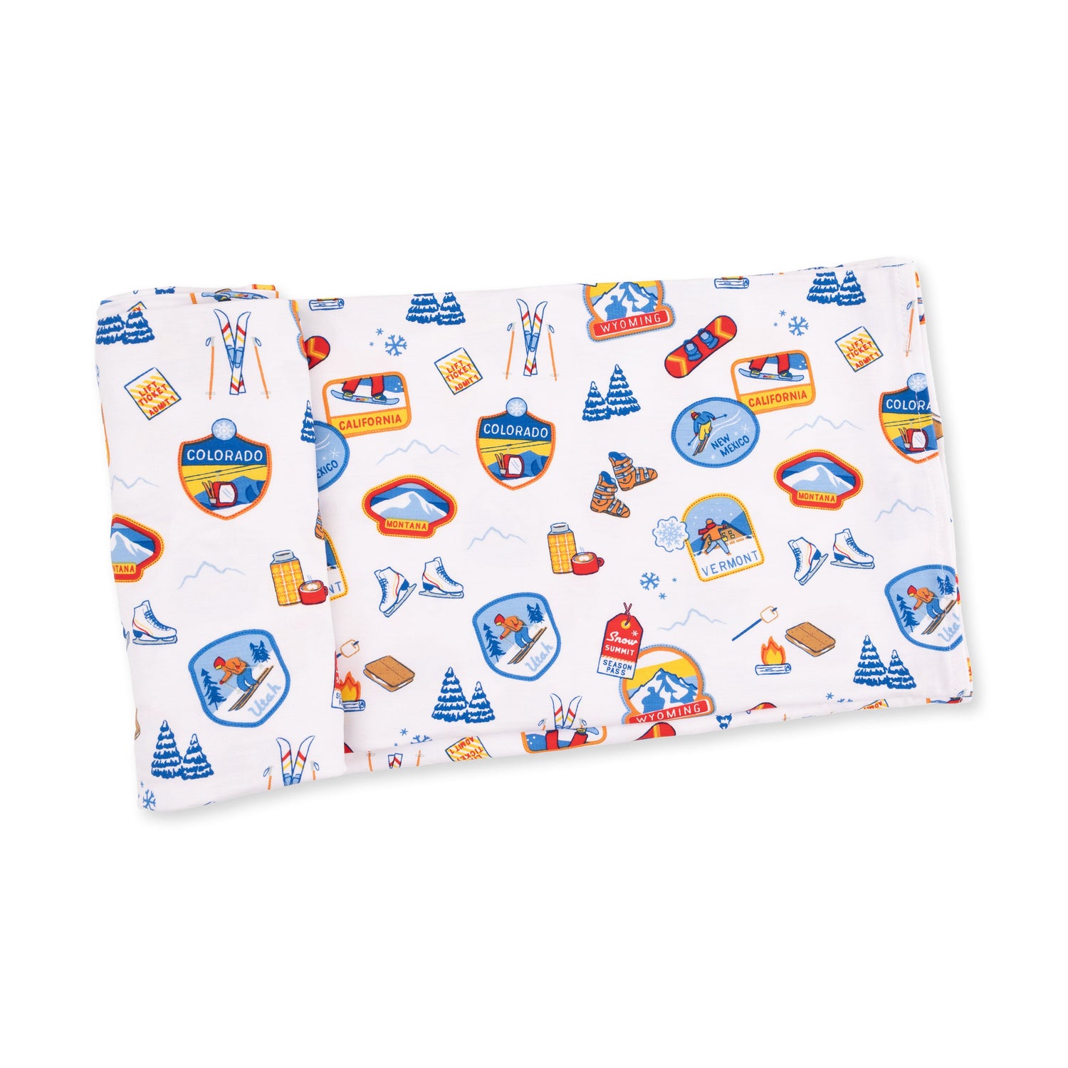 Swaddle blanket printed with vintage-style ski patches in retro colors on a light background