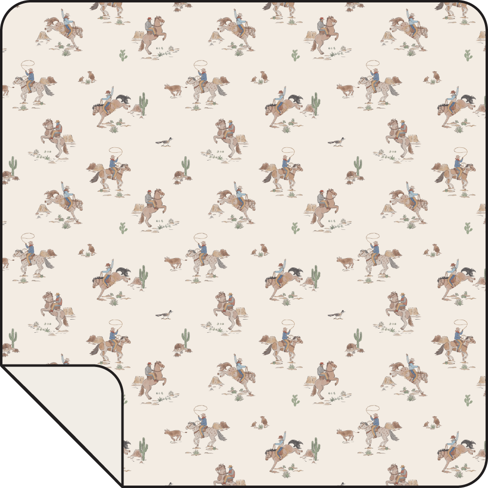 Swaddle blanket with a horse and wrangler print across a light background