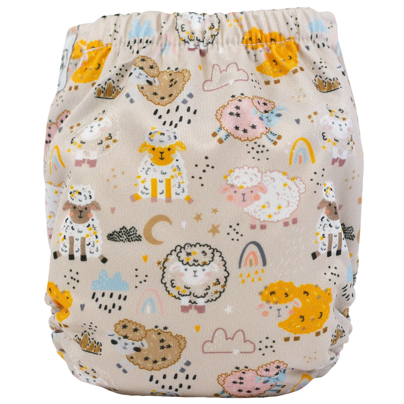 Tiny Tushies Newborn AIO Cloth Diaper with cute animal print, designed for 5-20 lbs, featuring dirty closure snaps and pocket opening for extra absorbency.