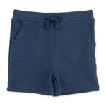 Solid insignia blue baby shorts in French terry with a drawstring waistband and two front pockets.