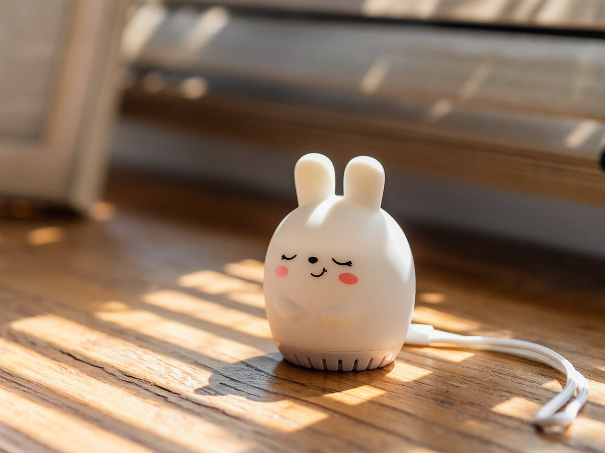 Sleeping Pal bunny-shaped mini sound machine night light for toddlers.