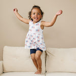 Little Joy Co. baby wearing a soft bamboo tee and bike shorts set, smiling and playing