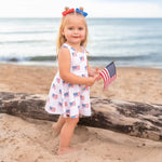 Little Joy Co. baby wearing a soft bamboo tee and bike shorts set, smiling and playing