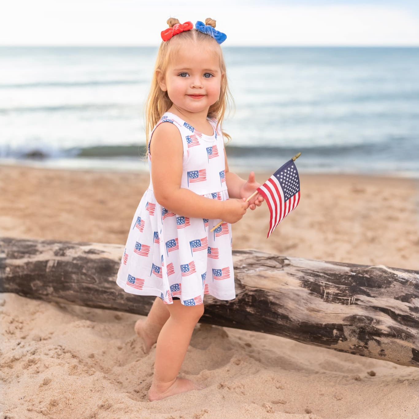 Little Joy Co. baby wearing a soft bamboo tee and bike shorts set, smiling and playing