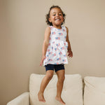 Little Joy Co. baby wearing a soft bamboo tee and bike shorts set, smiling and playing