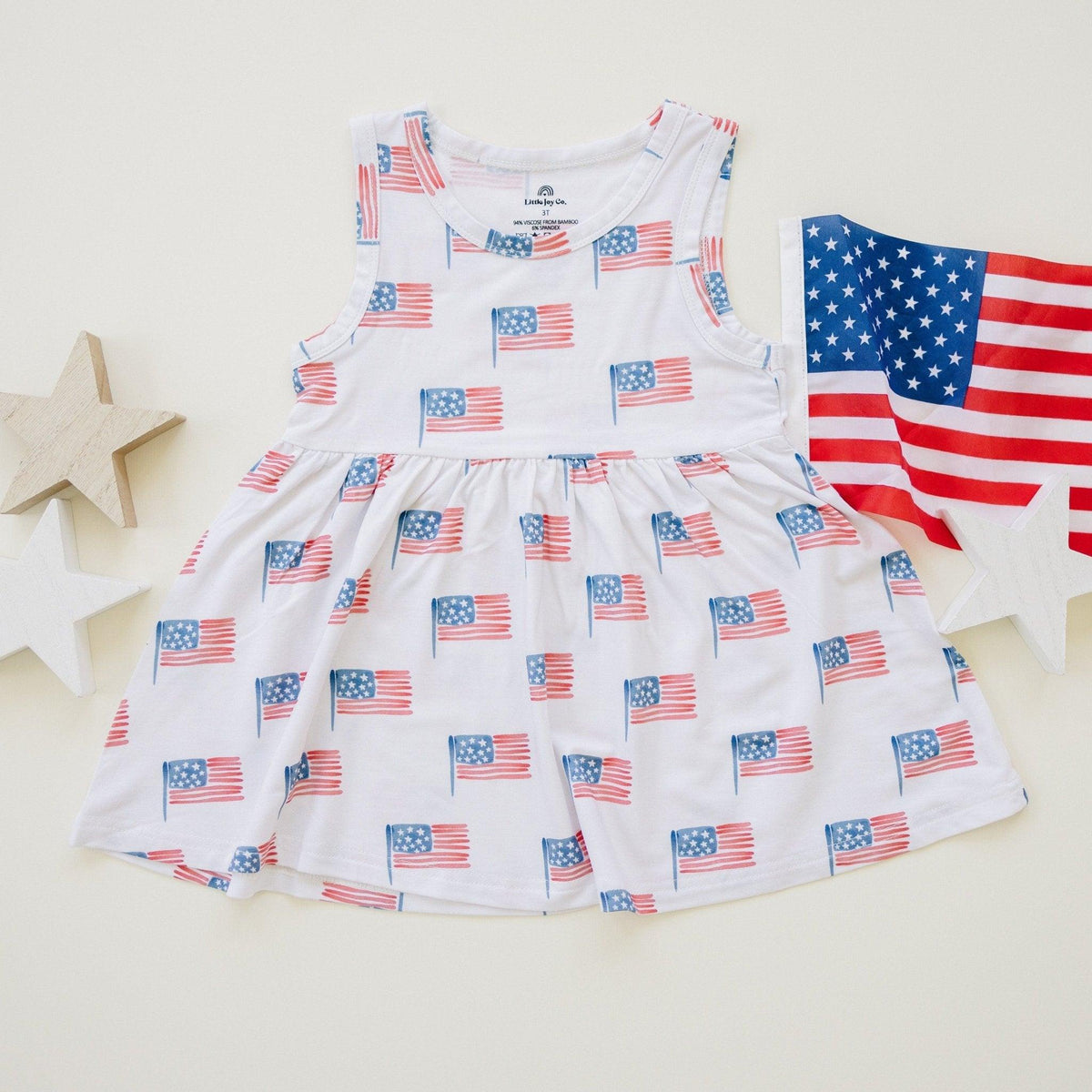 Little Joy Co. baby wearing a soft bamboo tee and bike shorts set, smiling and playing