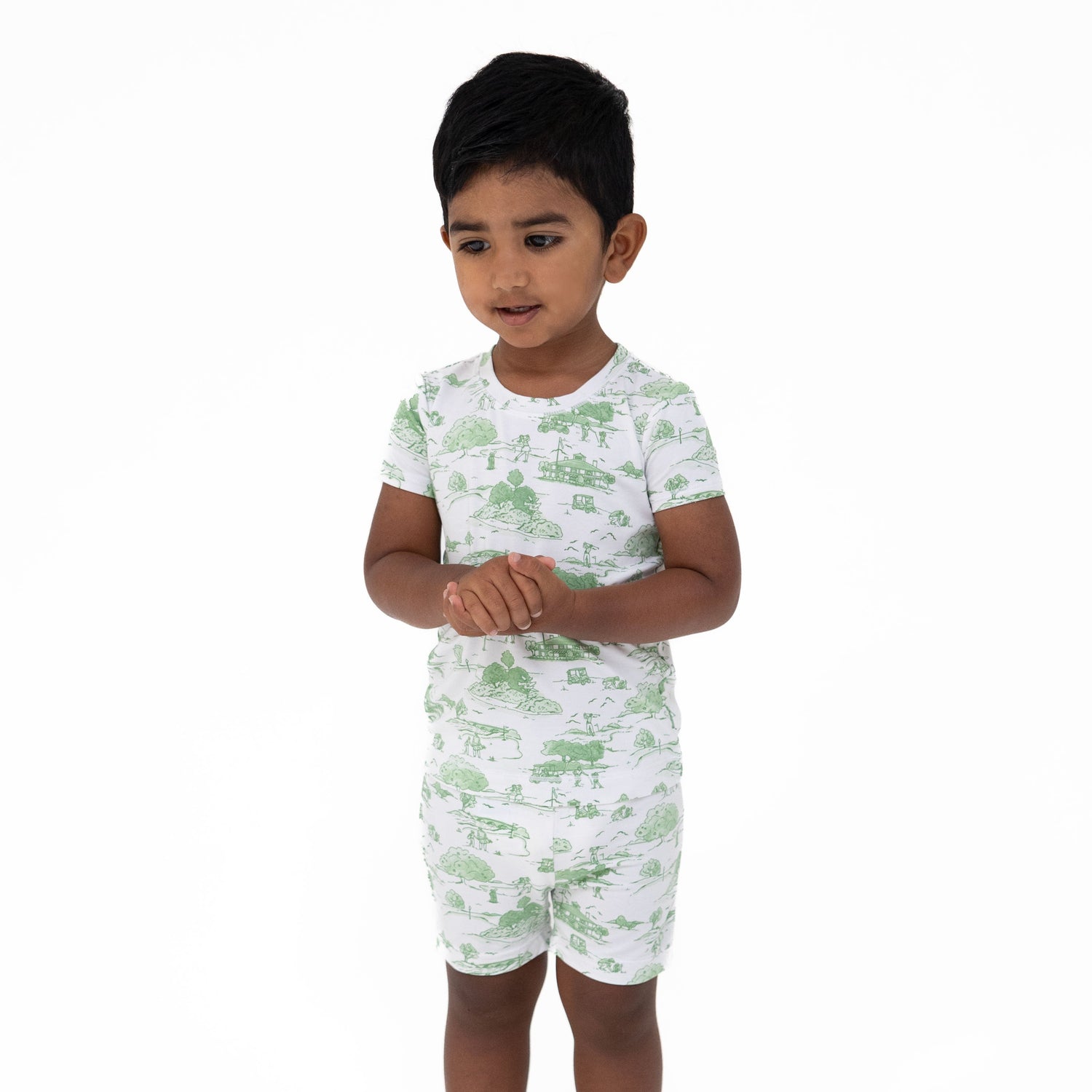 Two-piece loungewear short set in green golf toile print, matching top and pull-on shorts