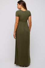 Woman wearing PinkBlush olive draped maternity nursing maxi dress, smiling, showing draped detail
