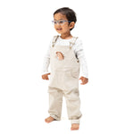 Tan peyote corduroy baby overall with horse head applique on the front and a muslin bandana in the back pocket
