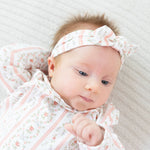 Knot headband in a rosebud stripe pattern with a knotted bow detail at the front.
