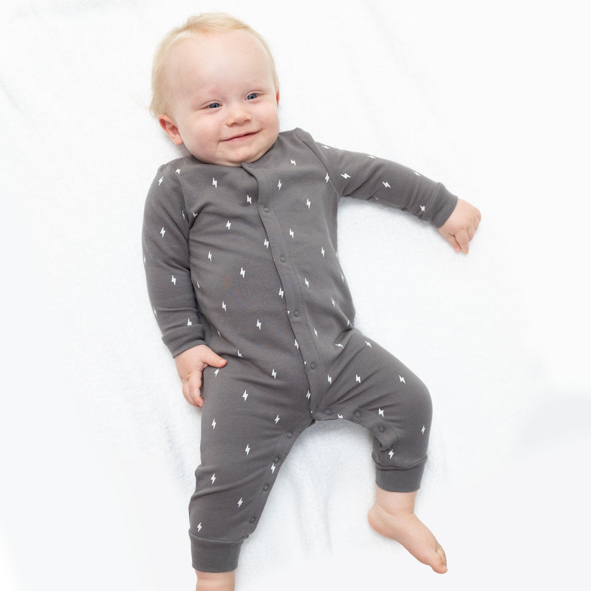 Baseball collar button-up romper in lightning bolt French terry with contrast collar and front placket.